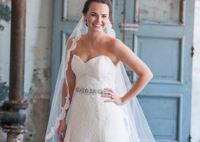 Bridal portraits at 701 Whaley by rustic door