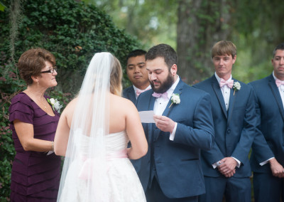 Wedding vows being read by groom