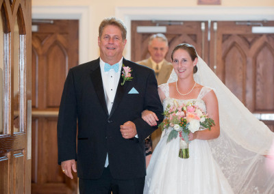 Dad escorting bride down the aisle