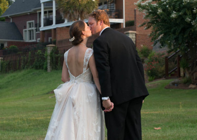 Kiss while walking by Stone River in Riverwalk park