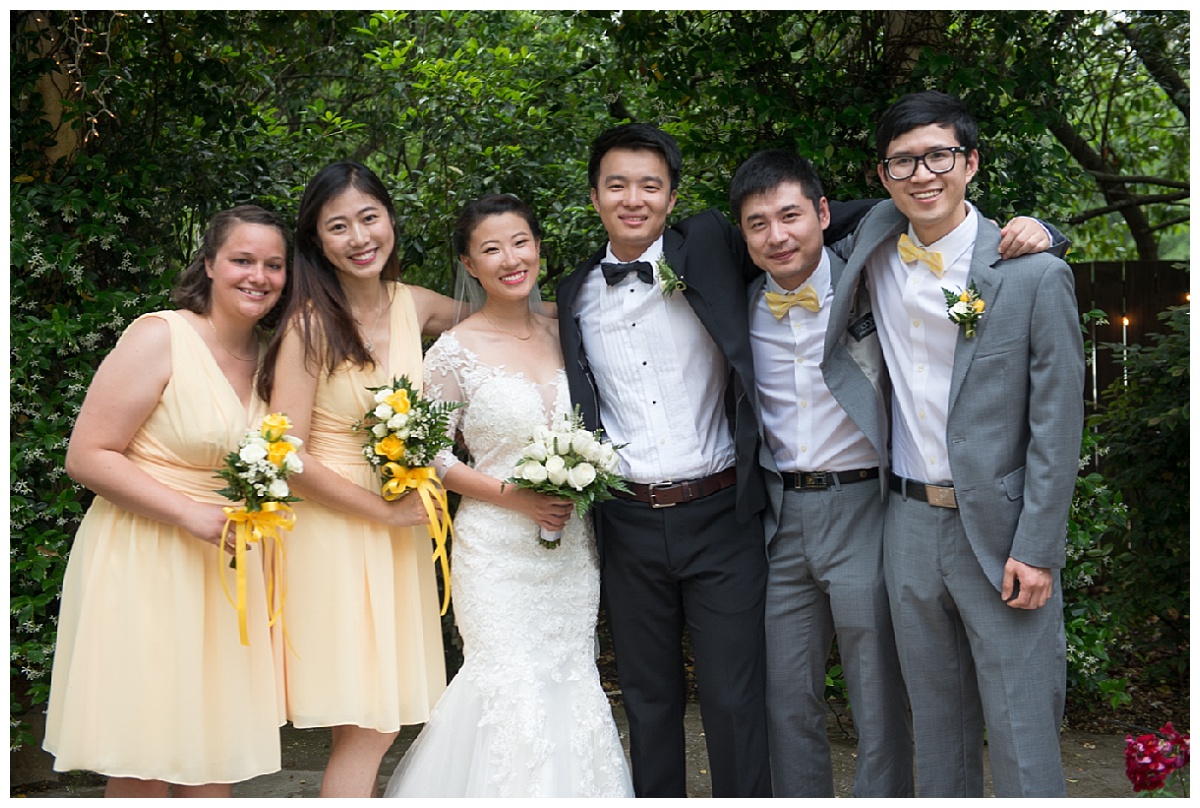 Wedding party in yellow dresses and grey suits