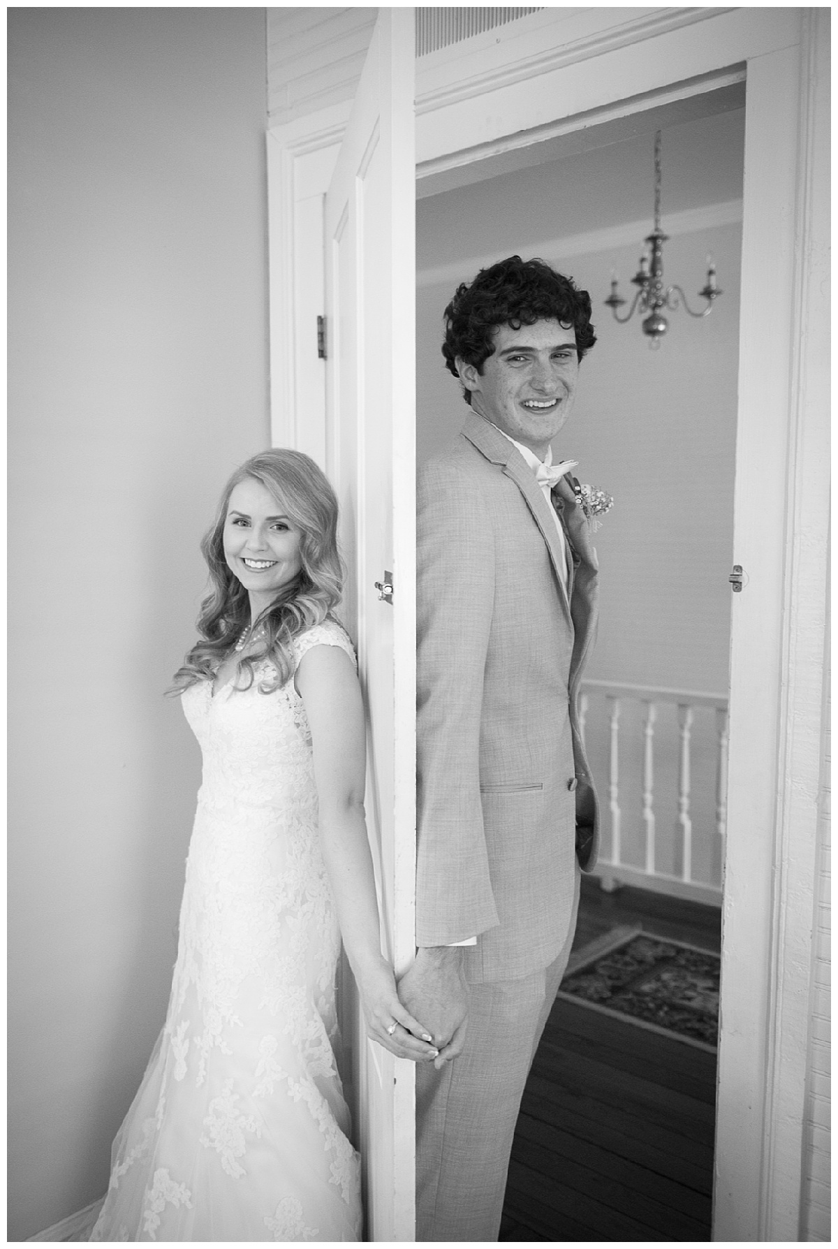 Corley Mill House wedding couple holding hands around door