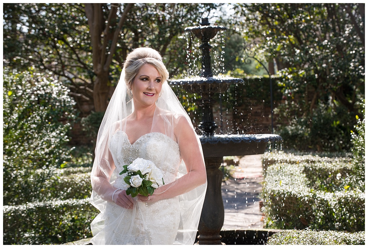 Bride by a fountain at the Lace House